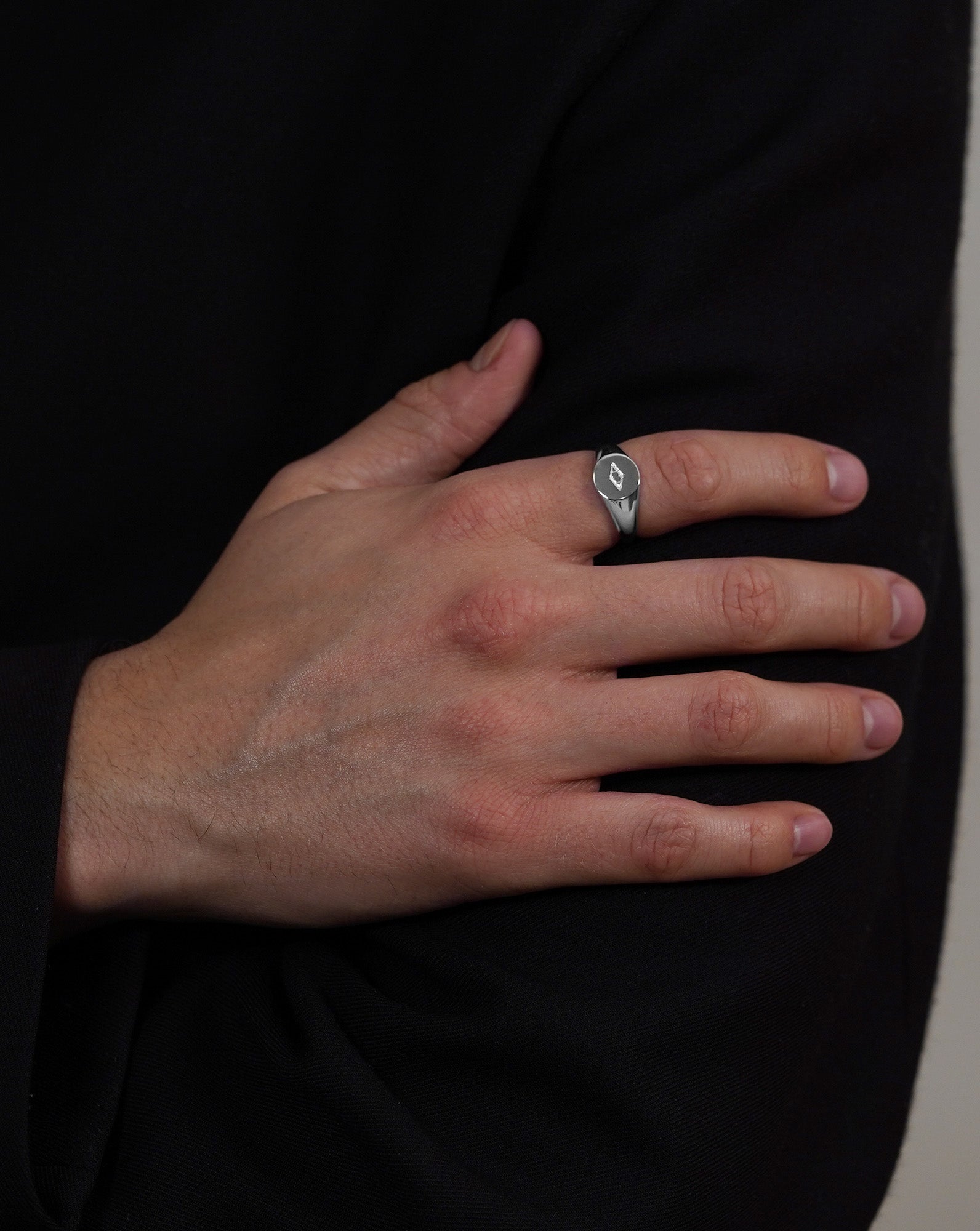 Men's Silver signet ring. Model wearing ring. Acardi Oval signet ring.