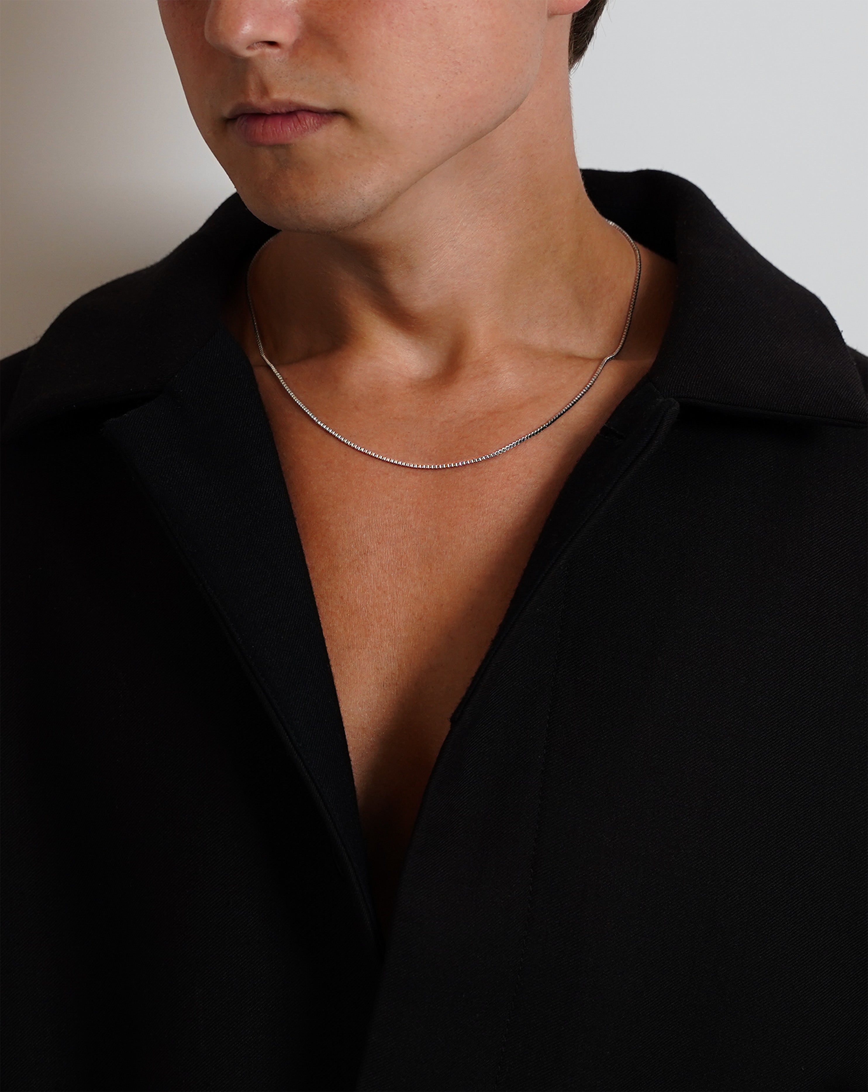 Silver thin Box chain necklace minimalistic Acardi on model. Men's jewellery