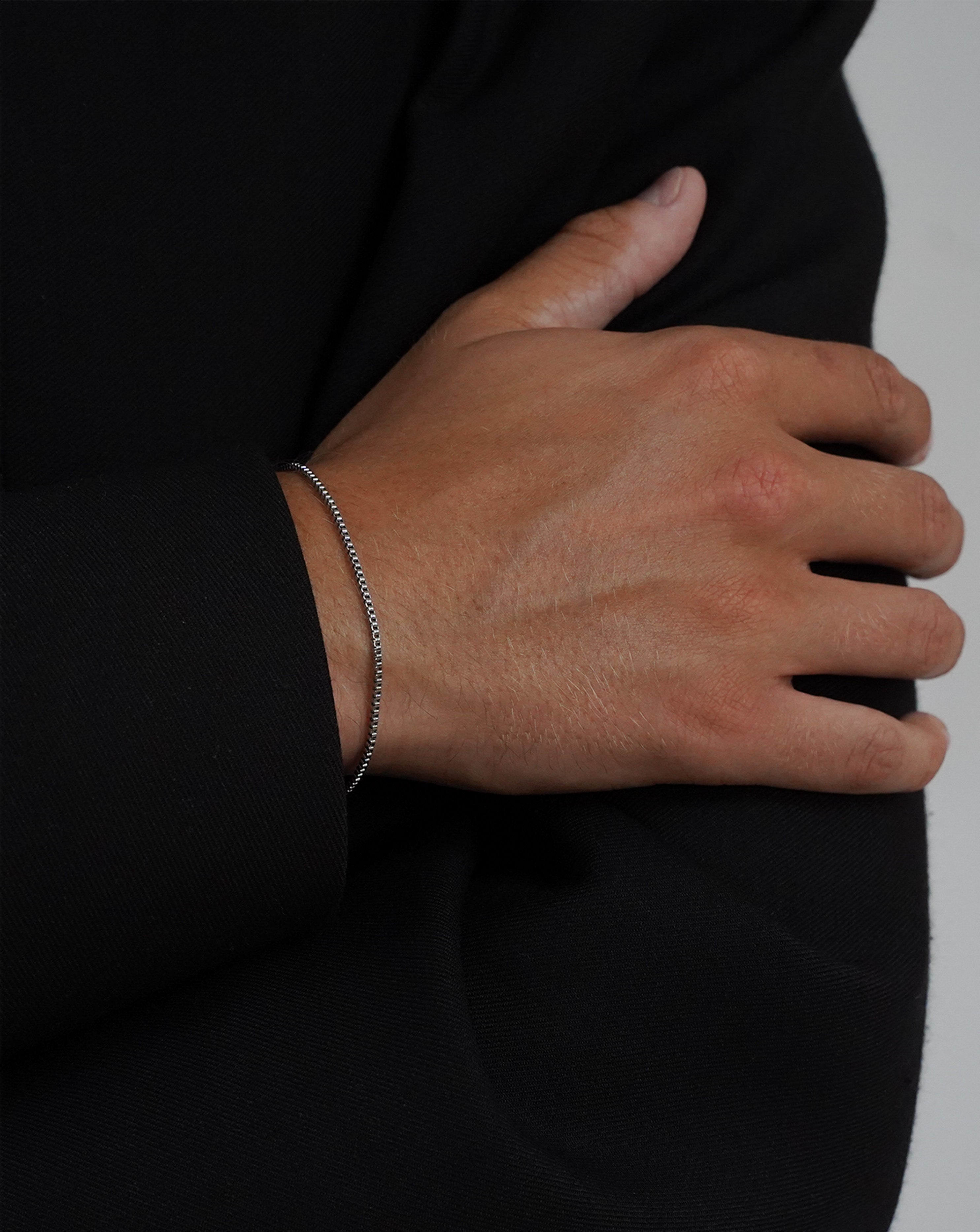 Silver thin Box chain bracelet minimalistic Acardi on model from the side. Men's jewellery